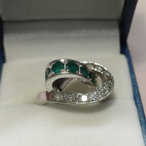 248 - Stunning Ladies Emerald and Diamond Ring in unusual design.
- 18ct White Gold