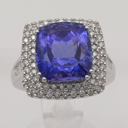 12 - A Stunning Tanzanite and Diamond Ring. 
- stone weight: 
Tanzanite 10 ct Diamond 1 ct
- weight 10.20... 