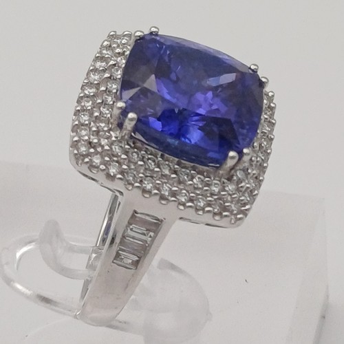 12 - A Stunning Tanzanite and Diamond Ring. 
- stone weight: 
Tanzanite 10 ct Diamond 1 ct
- weight 10.20... 