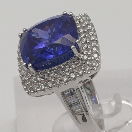 12 - A Stunning Tanzanite and Diamond Ring. 
- stone weight: 
Tanzanite 10 ct Diamond 1 ct
- weight 10.20... 