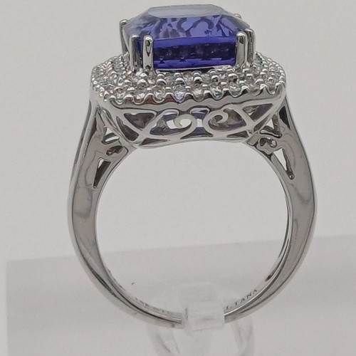 12 - A Stunning Tanzanite and Diamond Ring. 
- stone weight: 
Tanzanite 10 ct Diamond 1 ct
- weight 10.20... 