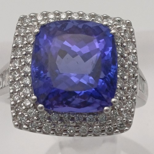 12 - A Stunning Tanzanite and Diamond Ring. 
- stone weight: 
Tanzanite 10 ct Diamond 1 ct
- weight 10.20... 