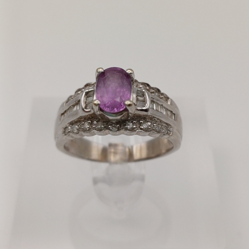 27 - This is an Amethyst set into a bucket effect shank with line of Diamonds above and below.
- 14ct whi... 