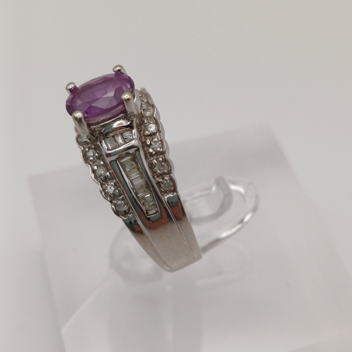 27 - This is an Amethyst set into a bucket effect shank with line of Diamonds above and below.
- 14ct whi... 