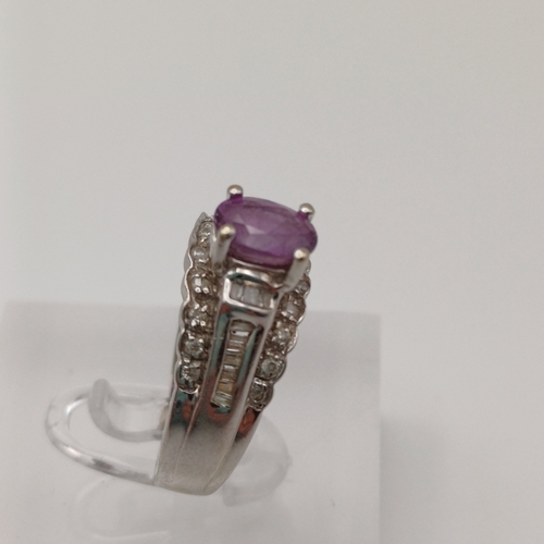 27 - This is an Amethyst set into a bucket effect shank with line of Diamonds above and below.
- 14ct whi... 