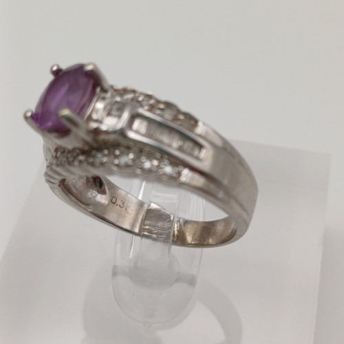 27 - This is an Amethyst set into a bucket effect shank with line of Diamonds above and below.
- 14ct whi... 