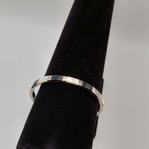 38 - Pretty Mother of Pearl and Onyx Bangle on a silver colour metal