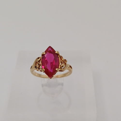 44 - A pretty Ruby Ring.  The Ruby is set into a detailed decorative shank.
- 10ct yellow gold
- Size E /... 