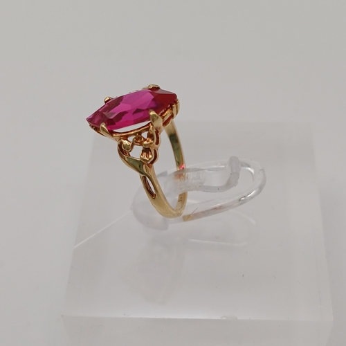 44 - A pretty Ruby Ring.  The Ruby is set into a detailed decorative shank.
- 10ct yellow gold
- Size E /... 