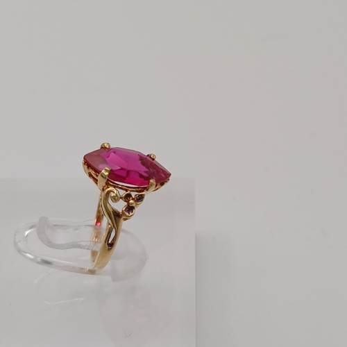 44 - A pretty Ruby Ring.  The Ruby is set into a detailed decorative shank.
- 10ct yellow gold
- Size E /... 