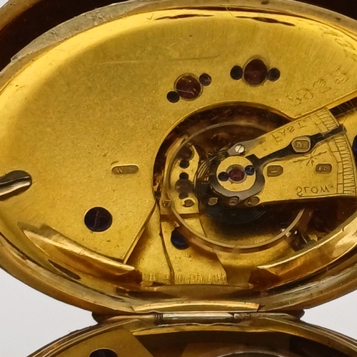 62 - A lovely Pocket Watch in 18ct Gold with engraved design on the cover in working condition.