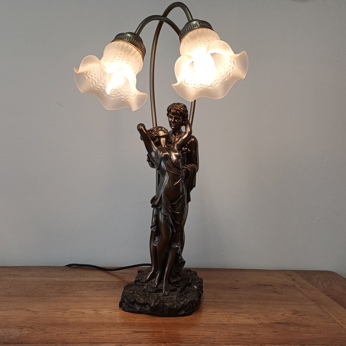 92 - Very stunning and elegant table lamp in cold bronze of a couple with two lamps.