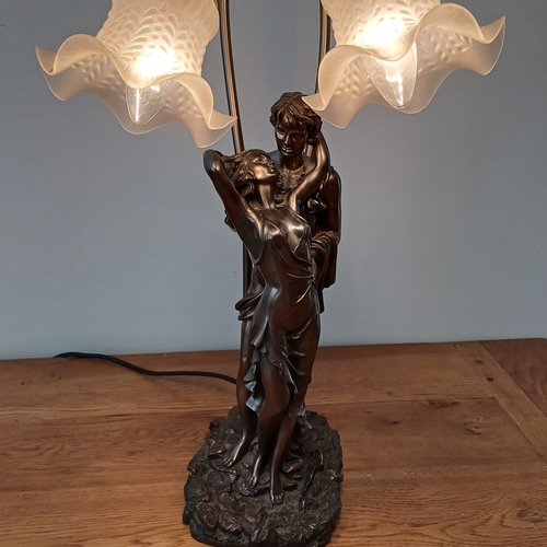 92 - Very stunning and elegant table lamp in cold bronze of a couple with two lamps.