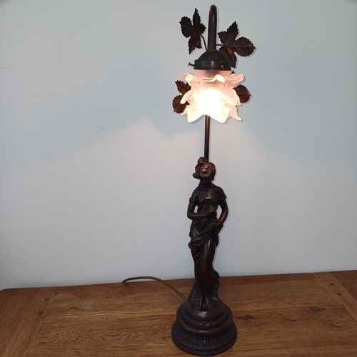 93 - Very pretty table lamp in cold bronze of a lady standing under the lamp.