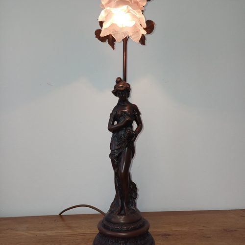 93 - Very pretty table lamp in cold bronze of a lady standing under the lamp.