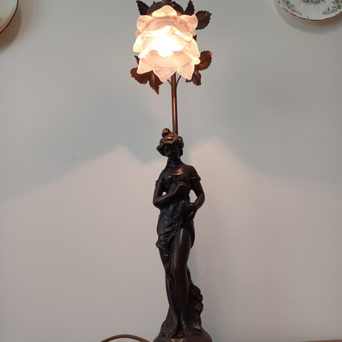 93 - Very pretty table lamp in cold bronze of a lady standing under the lamp.