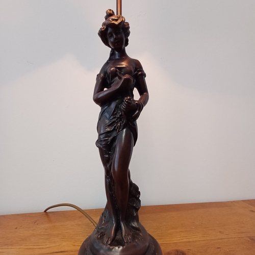 93 - Very pretty table lamp in cold bronze of a lady standing under the lamp.