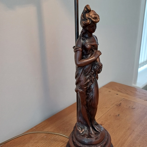 93 - Very pretty table lamp in cold bronze of a lady standing under the lamp.