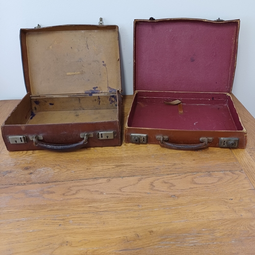 96 - Two heavy leather cases in a used condition