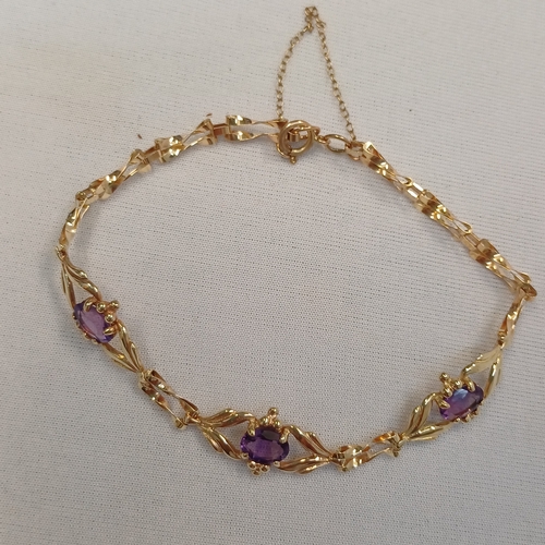 111 - Very pretty Three Stone Amethyst Bracelet set in 9ct yellow gold weighing 4.89 g