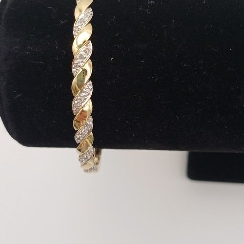 9 - Very eye catching Diamond Bangle.
- 9ct yellow gold
- there are 21 diamonds set in
- weight 8.79 g