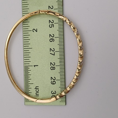 9 - Very eye catching Diamond Bangle.
- 9ct yellow gold
- there are 21 diamonds set in
- weight 8.79 g