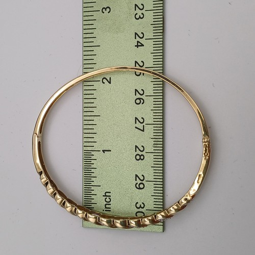 9 - Very eye catching Diamond Bangle.
- 9ct yellow gold
- there are 21 diamonds set in
- weight 8.79 g