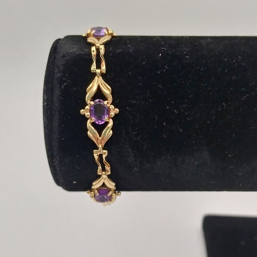 10 - Very pretty Three Stone Amethyst Bracelet set in 9ct yellow gold weighing 4.89 g