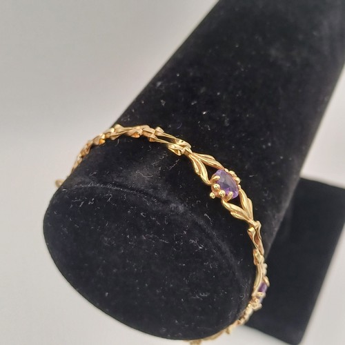 10 - Very pretty Three Stone Amethyst Bracelet set in 9ct yellow gold weighing 4.89 g