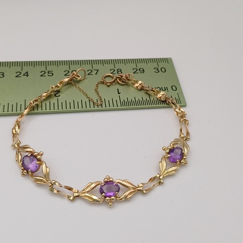 10 - Very pretty Three Stone Amethyst Bracelet set in 9ct yellow gold weighing 4.89 g