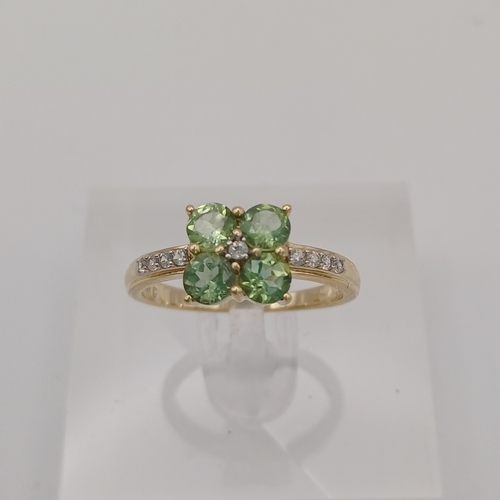 25 - A pretty Peridot and White Stone Cluster Ring
- size N
- weight 2.45g
- 9ct yellow gold