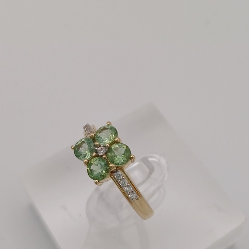 25 - A pretty Peridot and White Stone Cluster Ring
- size N
- weight 2.45g
- 9ct yellow gold