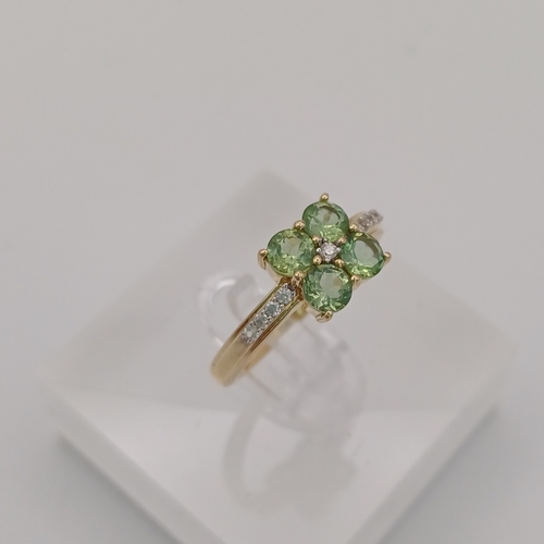 25 - A pretty Peridot and White Stone Cluster Ring
- size N
- weight 2.45g
- 9ct yellow gold