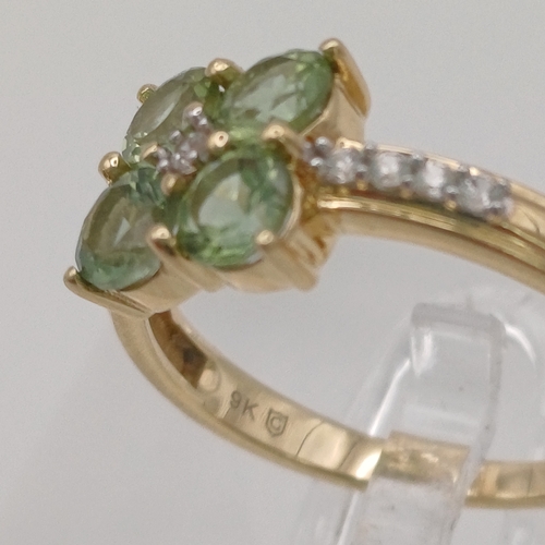 25 - A pretty Peridot and White Stone Cluster Ring
- size N
- weight 2.45g
- 9ct yellow gold