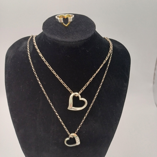 29 - Here we have two Silver Heart Shaped Pendants with chains and a two tone heart shared ring.
- chain ... 