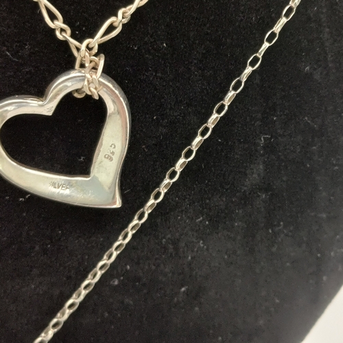 29 - Here we have two Silver Heart Shaped Pendants with chains and a two tone heart shared ring.
- chain ... 