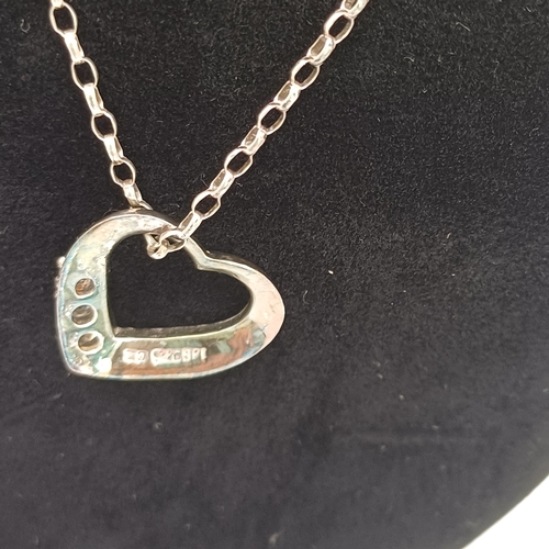 29 - Here we have two Silver Heart Shaped Pendants with chains and a two tone heart shared ring.
- chain ... 