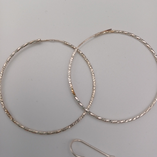 53 - Two pairs of earrings:
1- hoops
1 - Sun and Moon