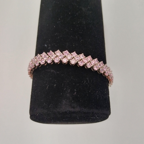 55 - A Three Stone Wide Line Bracelet in pink stone
- 925 silver
- weight 23.12