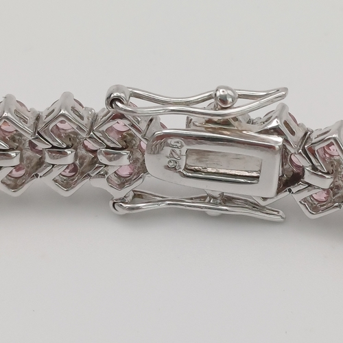 55 - A Three Stone Wide Line Bracelet in pink stone
- 925 silver
- weight 23.12