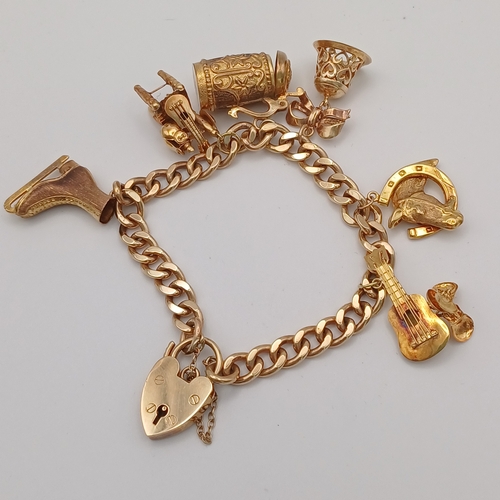 57 - A Lovely Charm Bracelet with 6 charms
- 9ct yellow gold
- weight 38.20g