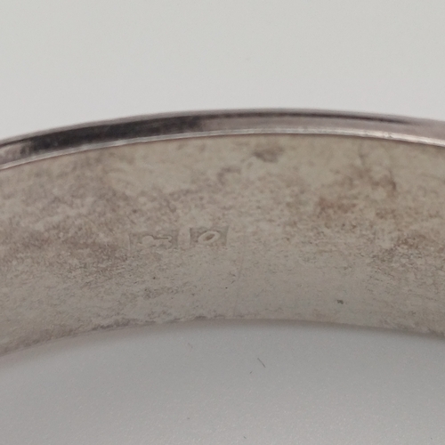 59 - Silver Hing Bangle with design all round
- weight 20.22g