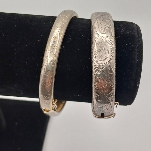 60 - Two Silver Hing Bangles
- total weight 34.40g