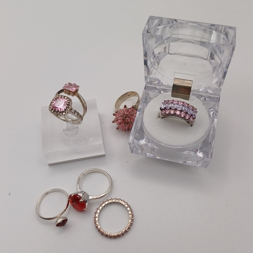 68 - Collection of 7 Ladies Rings with either Pink Stones or Red Stones.
- size range L to O
- collective... 