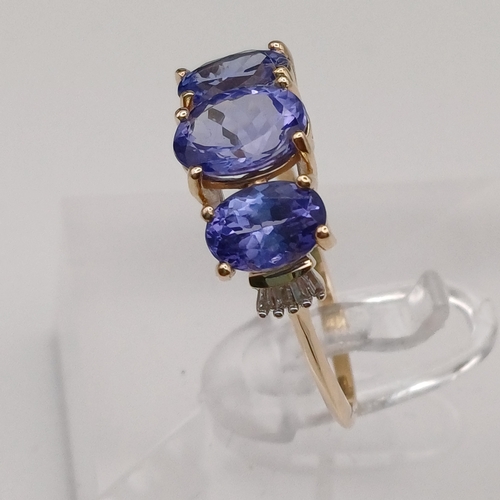 77 - Pretty Tanzanite Three Stone Ring
- 9ct yellow gold
- size R
- weight 2.45g