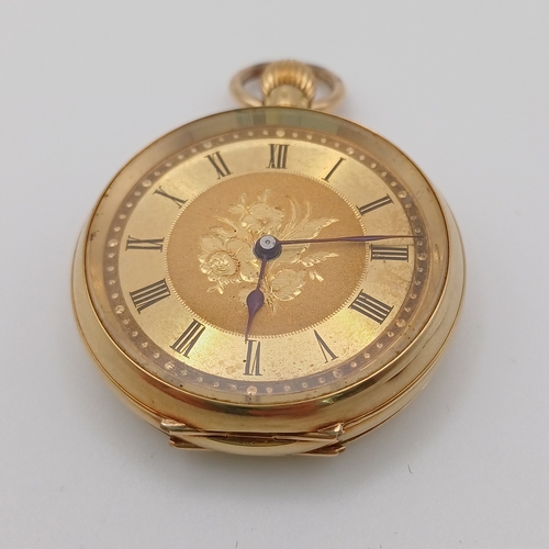 83 - This is a very pretty faced Ladies Pocket Watch with engraved design on the back.  
- 18ct yellow go... 