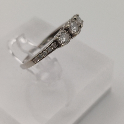 87 - Pretty three stone Diamond Ring with Diamonds set into the shoulder each side of the shank.
- size J... 