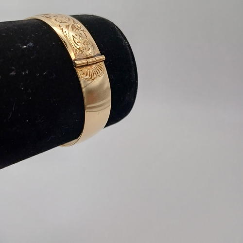 98 - A very pretty engraved design one side hing bangle
- weight 29.24g
- 1/5th 9ct rolled gold