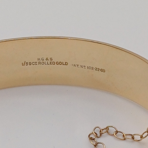 98 - A very pretty engraved design one side hing bangle
- weight 29.24g
- 1/5th 9ct rolled gold