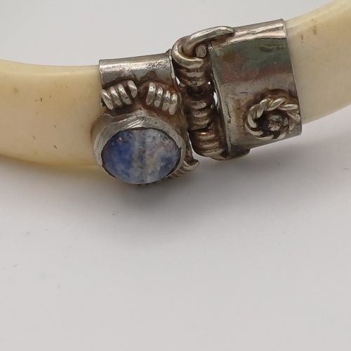 100 - Here we have a Bone Hinged Bangle with Cabochon Kyanite Blue Stones set in.  This is unusual Bangle ... 